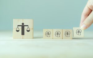 Ethical corporate culture concept. Ethics inside human mind. Business integrity and moral. Putting wooden cubes with ethics inside a head standing with ethical corporate. Sustainable business.