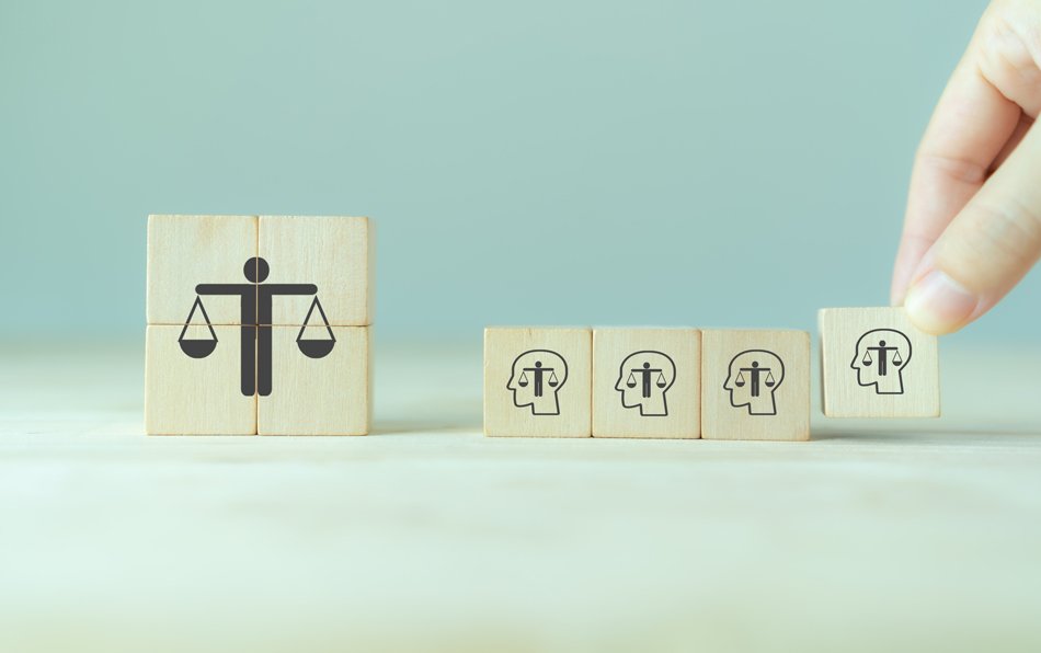 Ethical corporate culture concept. Ethics inside human mind. Business integrity and moral. Putting wooden cubes with ethics inside a head standing with ethical corporate. Sustainable business.