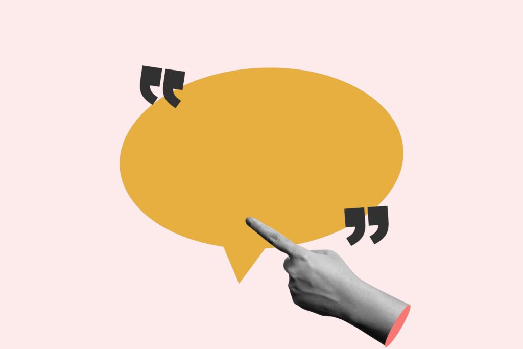 A human hand shows a blank speech bubble for copy space