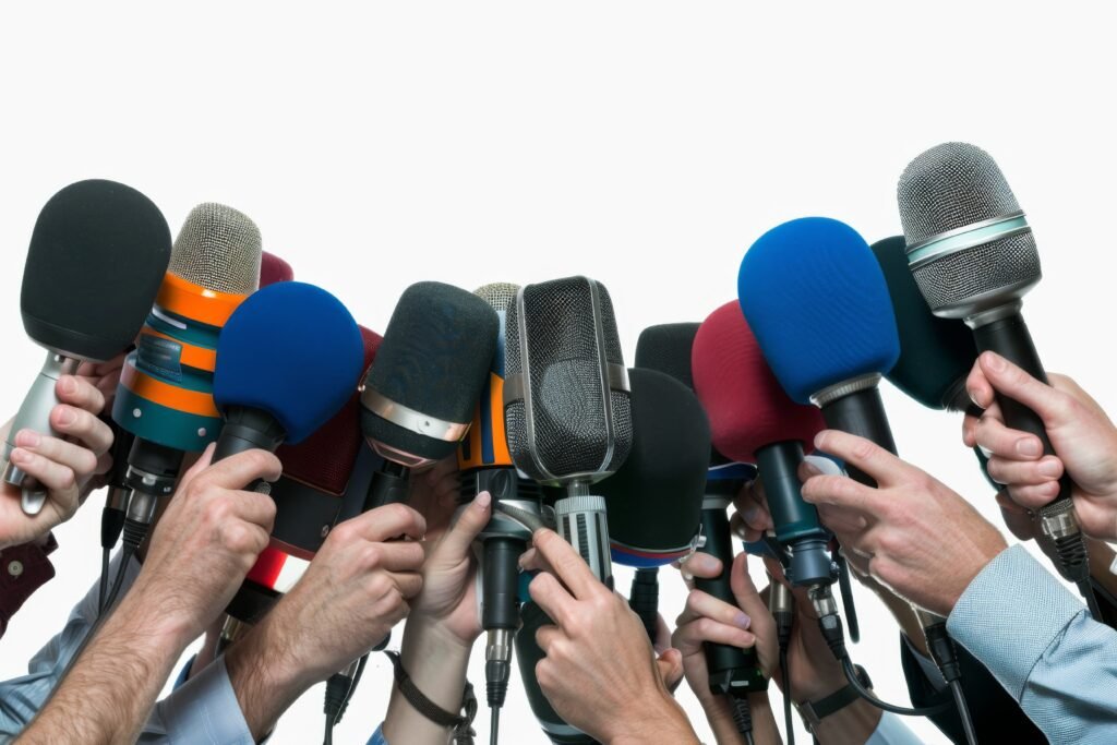 Microphones in hands of reporters on press conference or interview. Journalism and broadcasting